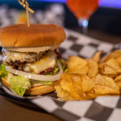 WT smash burger with potato chips on the side.