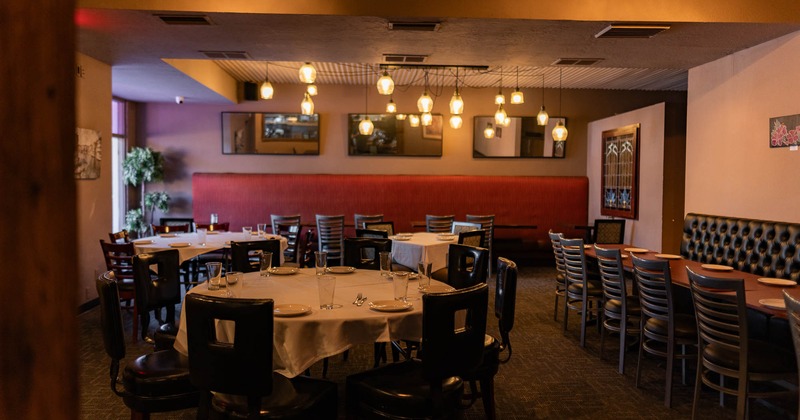 Interior, tables set for guests in dining area
