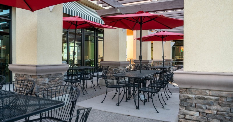 Exterior, patio tables and chairs and garden umbrellas
