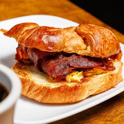 Croissant sandwich with bacon, egg, and cheese.