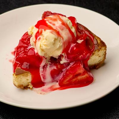 Strawberry cheesecake with ice cream.