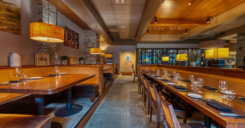 Interior, tables set for guests in dining area