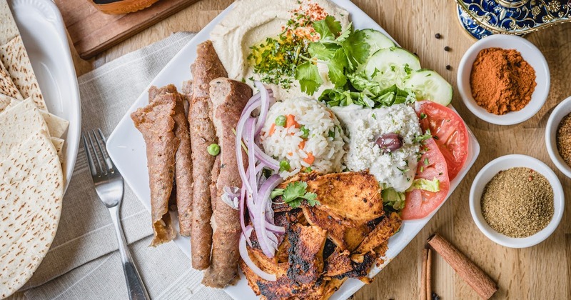 Chicken and gyro meats, with salad, rice, and dip