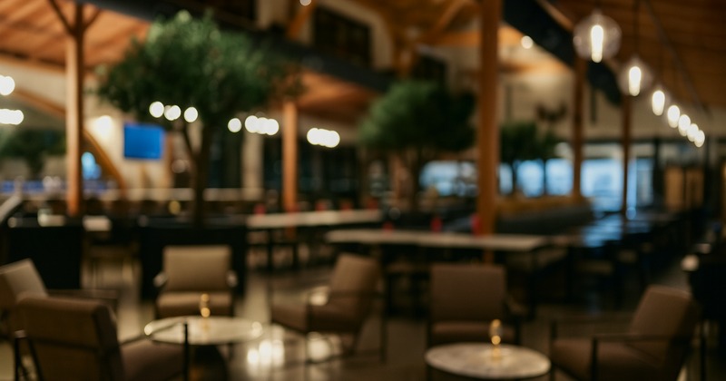 Blurred view of a restaurant interior with lounge seating