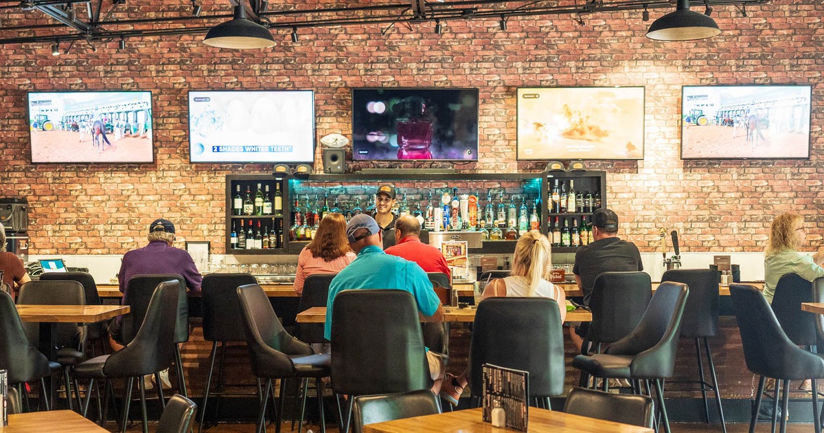 Bar area, bar, guests, bartender, tv screens above