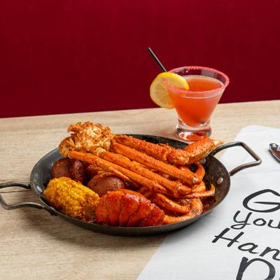 Lobster Tail Special with Tropical Cosmo on a table.