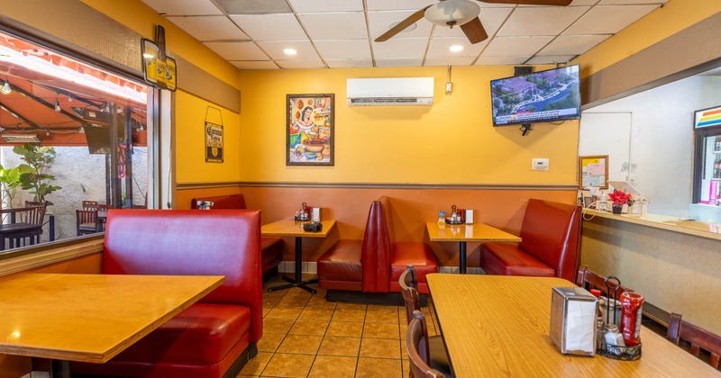 Casual diner with red booths and wooden tables