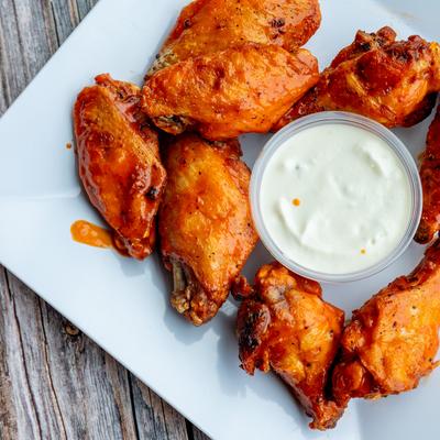 Wings and ranch sauce, top view.