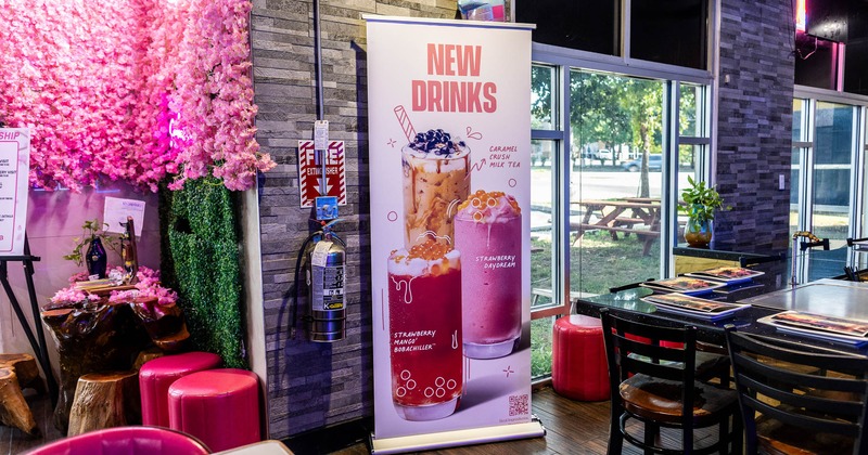 Interior featuring  a promotional banner for new bubble tea drinks