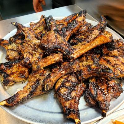 Large platter of grilled meat chops.