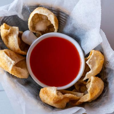 Fried wontons and sauce dip, top view