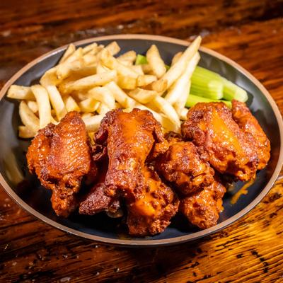 The Not Your Mama's Wings with a side of fries.