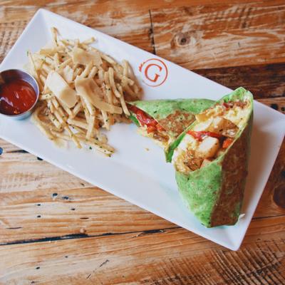 Gio Breakfast Burrito with fries and dipping sauce on the side.