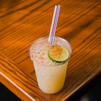 Lime Margarita garnished with a fresh lime wheel and a sprinkle of chili powder.