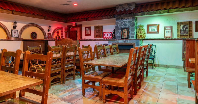 Interior, dining area with wooden tables and chairs, decor on the walls