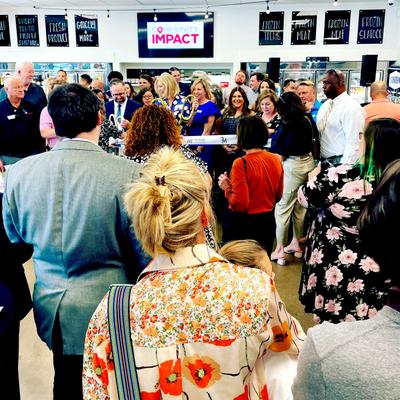 Crowd at a ribbon-cutting ceremony.