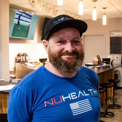 A staffer inside the restaurant, headshot.