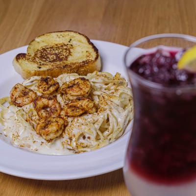 Cajun Shrimp Pasta and a cocktail.