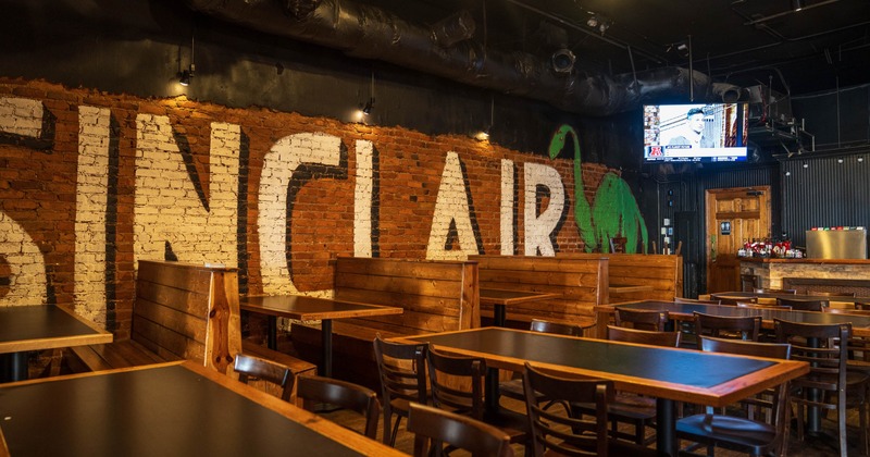 Interior, tables and chairs with booths in the back