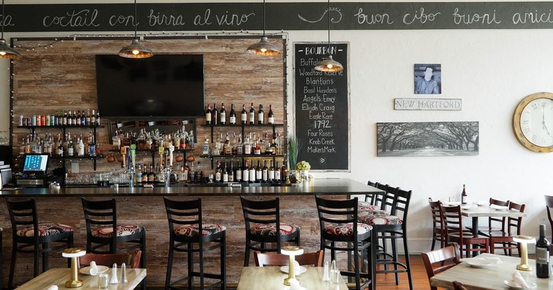 Interior, seating and bar area with wall decoration