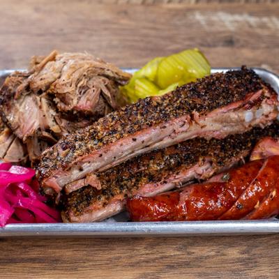 Ribs with pulled pork, sausage and pickles