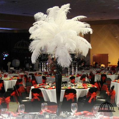 Feather centerpiece above formal dining tables.
