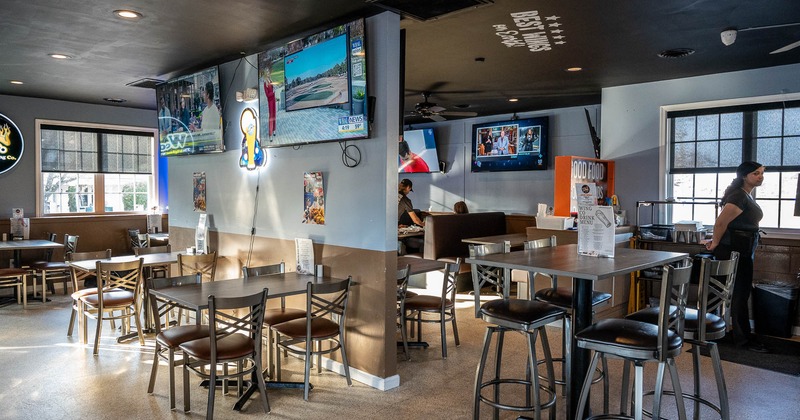 Interior, main seating area, big TV's on the wall