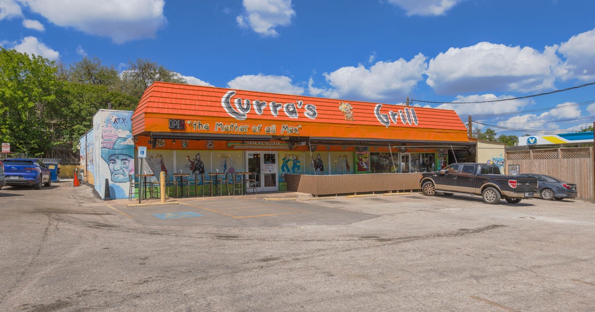 Exterior, front view to the restaurant, part of parking lot