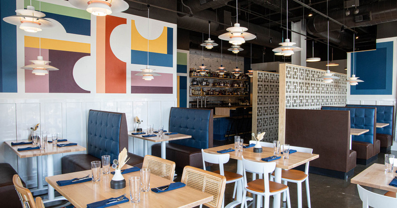 Interior, booths and tables set for dining