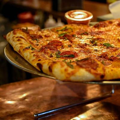 Pepperoni and basil square pizza.