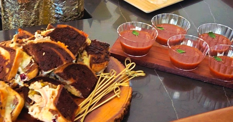 A catering setup featuring a variety of appetizers and drink