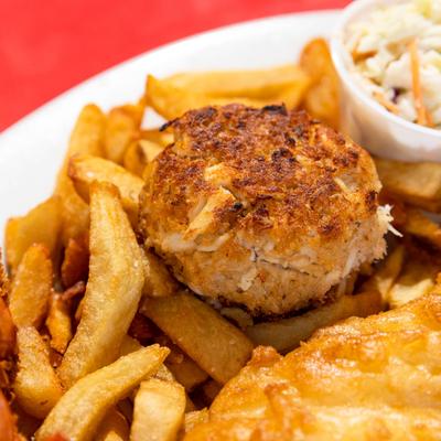 Crab cake, fries, and slaw, platter closeup