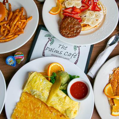 Multiple food plates displayed on a table, top view.