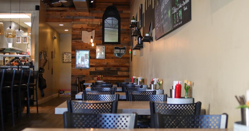 Dining tables inside, decoration on the wall