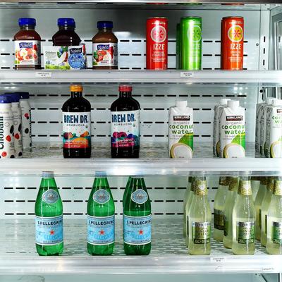 A fridge filled with assorted beverages.