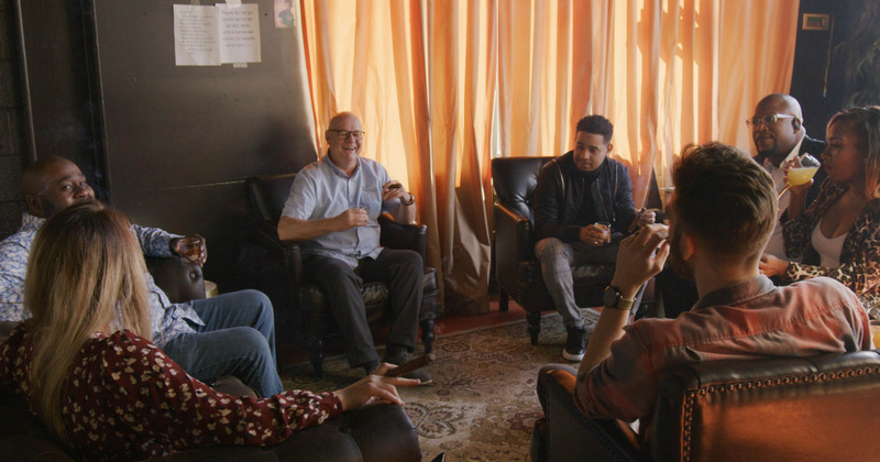 A group of people sitting and enjoying