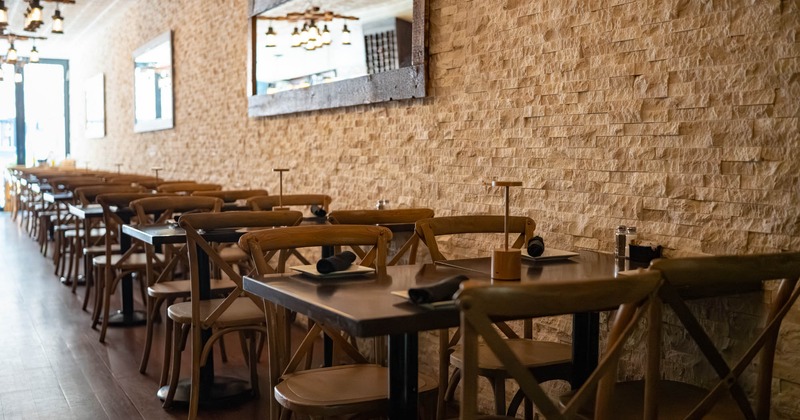 Inside, seating area with tables and chairs