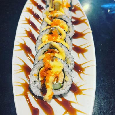 Golden Rolls, with salmon, cream cheese, asparagus, hot mayo, roe, and eel sauce.