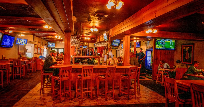 Interior, tables and chairs with bar in the middle
