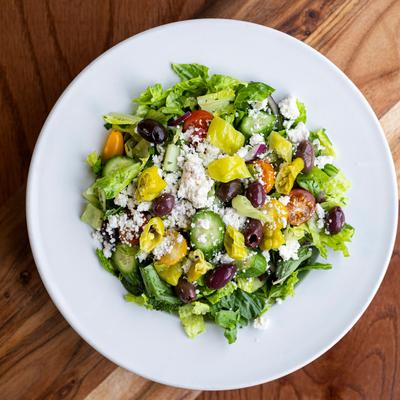 Food in white dish on brown table