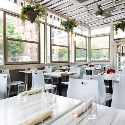 Diner area. white tables and chairs.