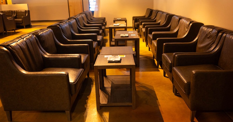 Interior, side view on armchairs and coffee tables