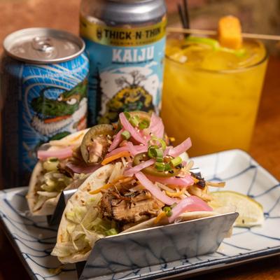 Chashu pork tacos, with pickled red onion, and scallions.