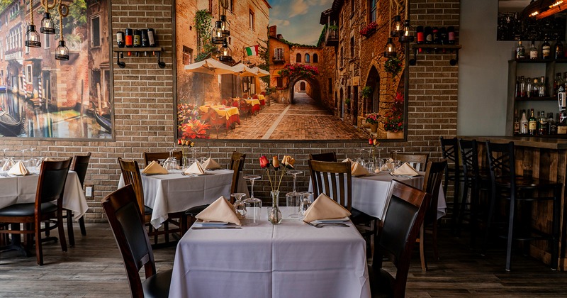 Nicely done interior dining area with set tables ready for guests