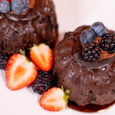 Lava cake topped with fresh berries, close up shot.