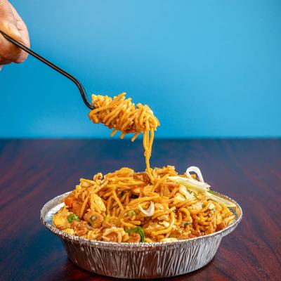 A fork stuck in Chicken & Egg Noodles.