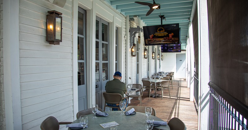 Cozy covered patio with set dining tables