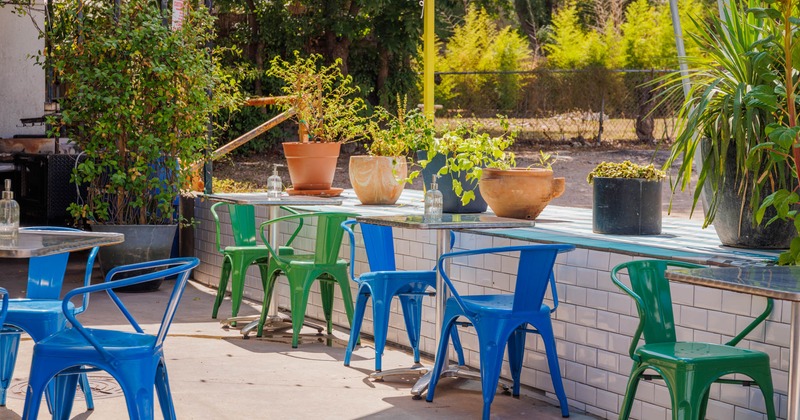 Exterior, blue and green chairs in garden