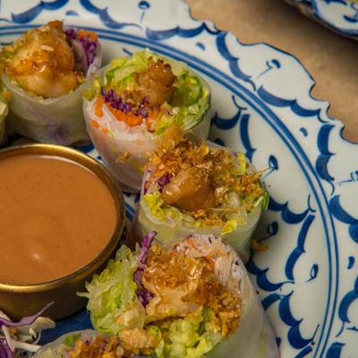 Fresh veggie rolls served with a side of peanut sauce.