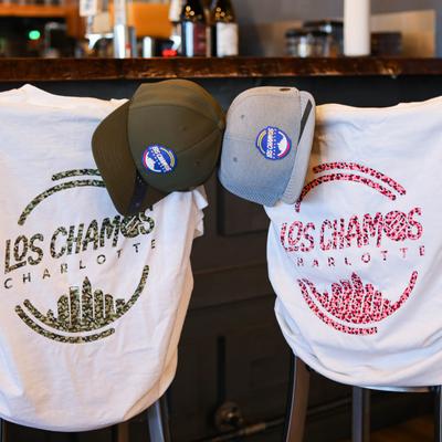T shirts and baseball caps with the restaurant logo.